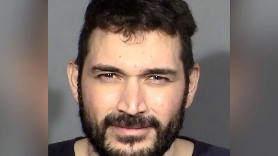 A Las Vegas man was arrested after he allegedly used an ax to damage a stranger’s car, while a child was inside, according to reports.